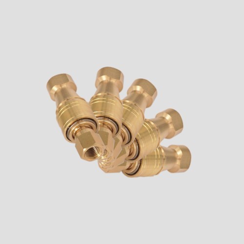 a pack of five brass couplers for quarter inch fittings
