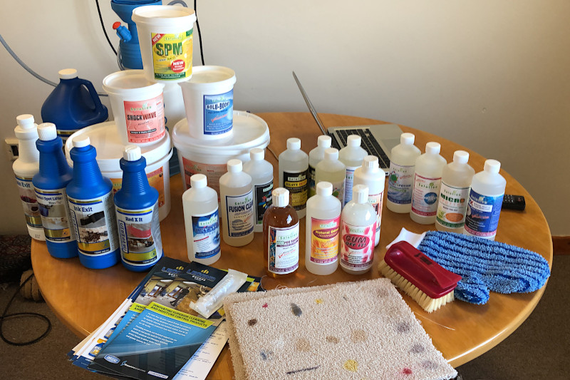 various carpet cleaning chemicals on a table